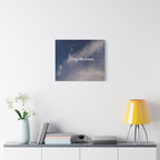 Canvas print with 'Stay the course.' text on a wall above a shelf with decor items.