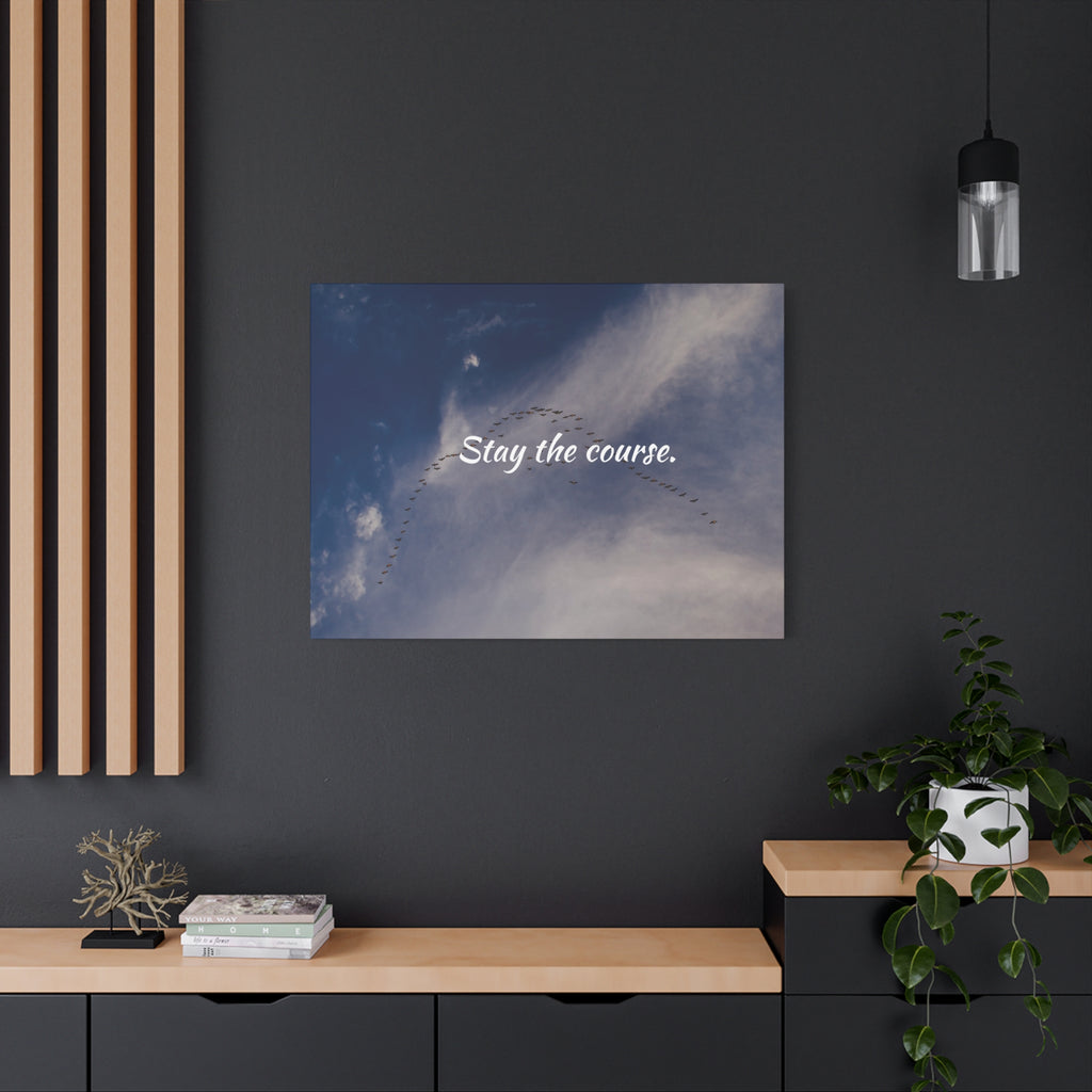 Poster with 'Stay the course.' text on a wall in a modern interior setting.