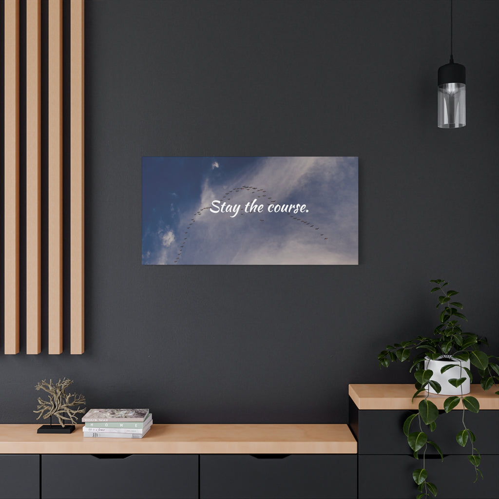 Wall art with 'Stay the course.' text in a modern interior setting.
