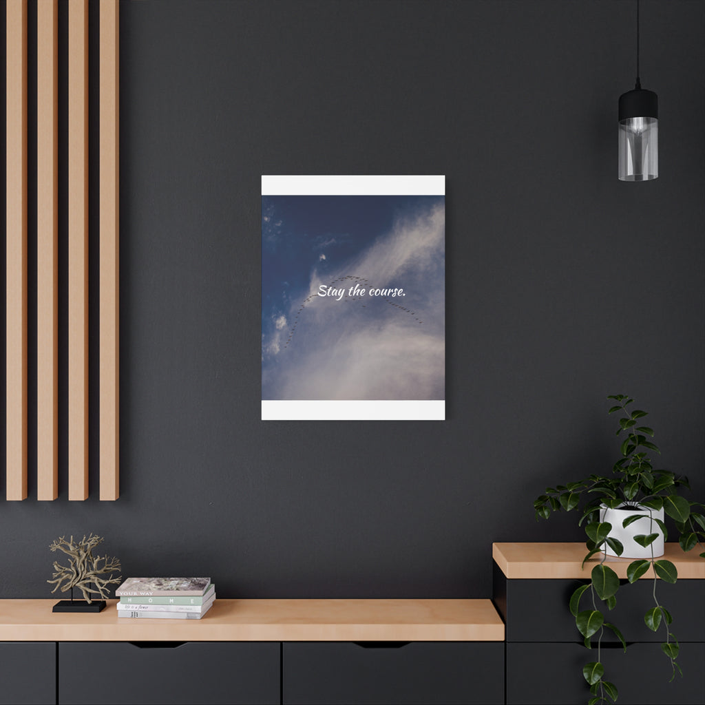 Poster with 'Stay the course.' text on a dark wall with wooden shelves and decor.