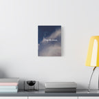 Canvas print with 'Stay the course.' text on a wall above a desk with books and a lamp.