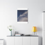Framed artwork with motivational quote on a wall above a desk with decor items.