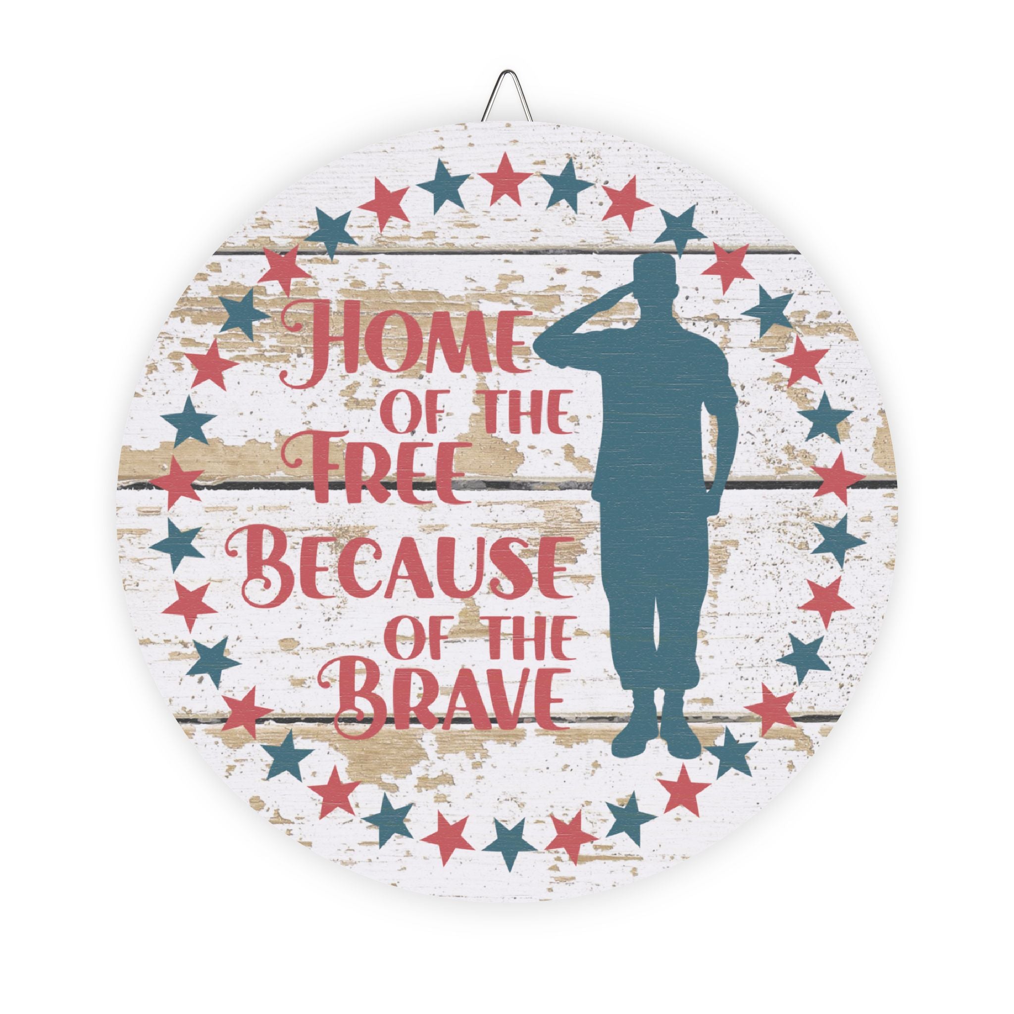 Decorative plate with a silhouette of a soldier and text 'Home of the Free Because of the Brave' on a wooden background.