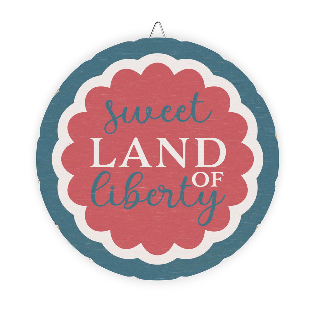 Decorative sign with 'sweet land of liberty' text on a white background