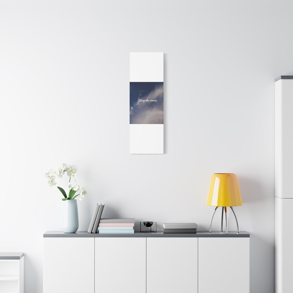 Modern interior with a yellow lamp, white vase with flowers, and framed picture on a white wall.