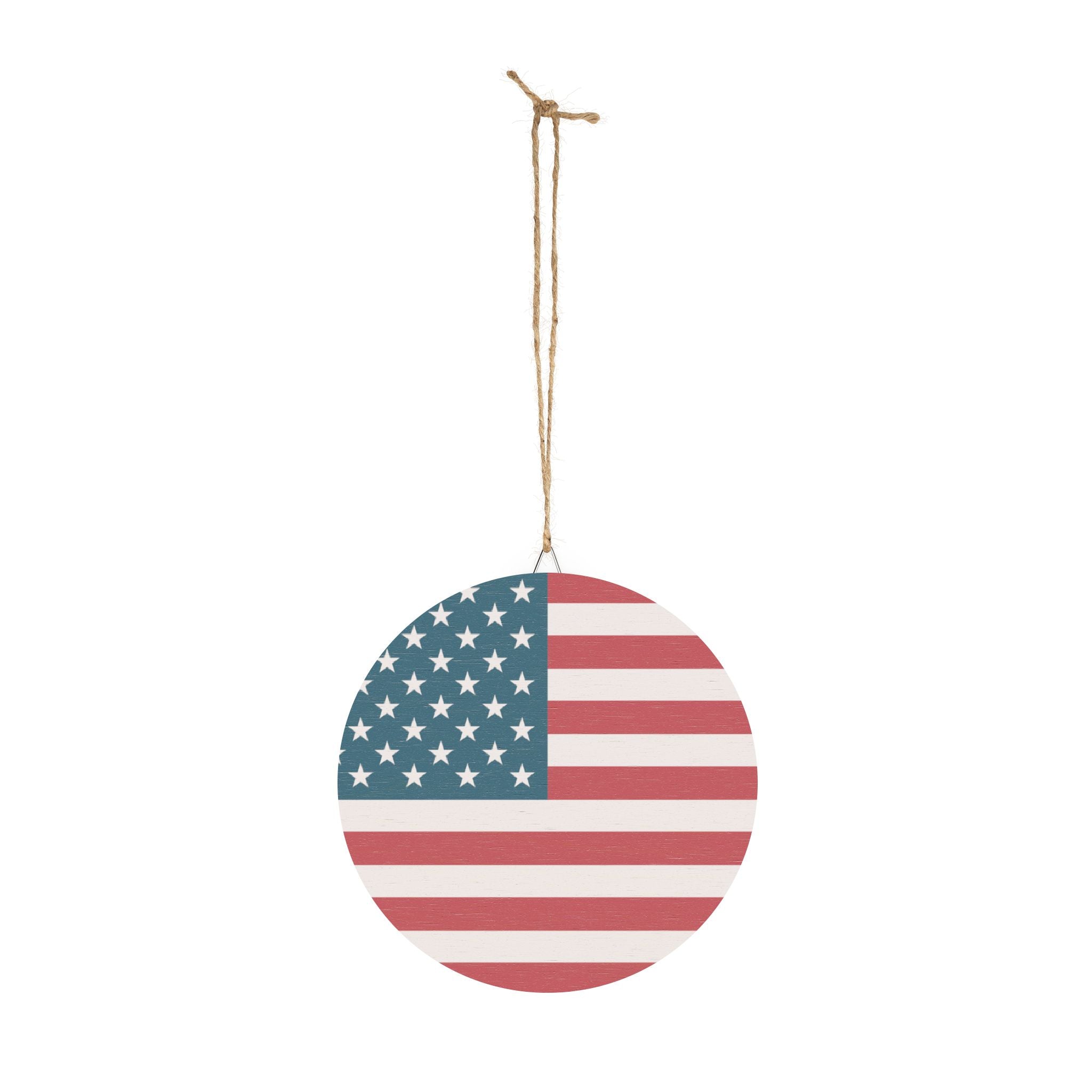 Round ornament with American flag design hanging on a white background