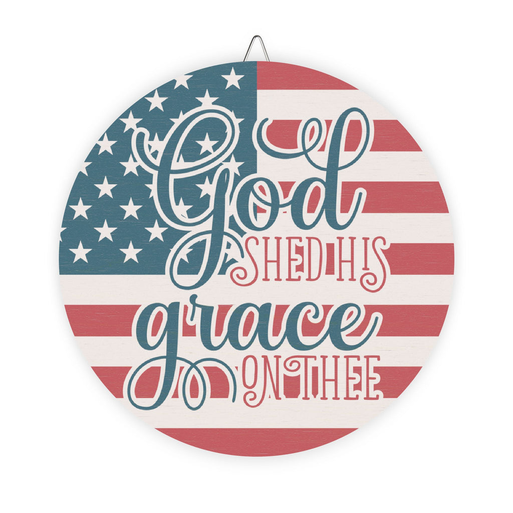 Decorative plate with American flag design and text 'God shed his grace on thee' on a white background.
