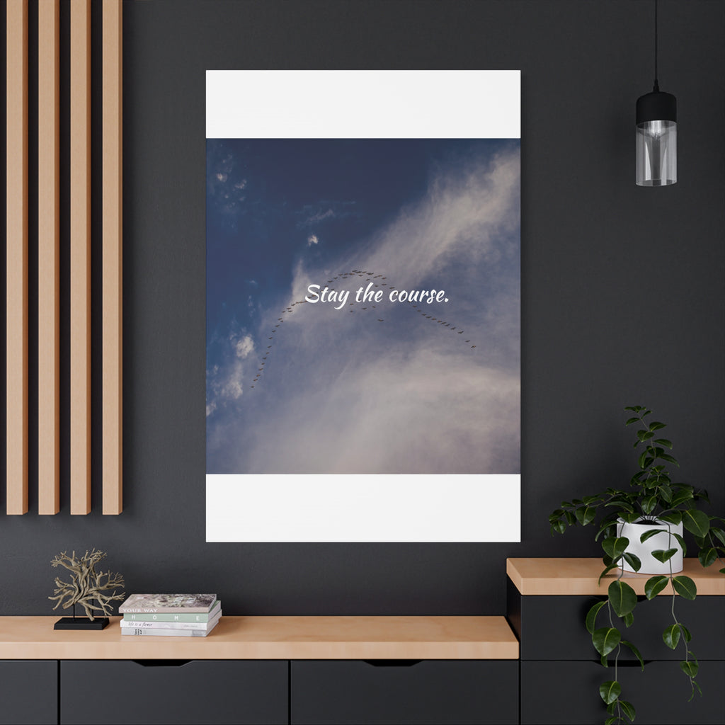 Poster with 'Stay the course.' text on a blue sky background in a modern interior setting.