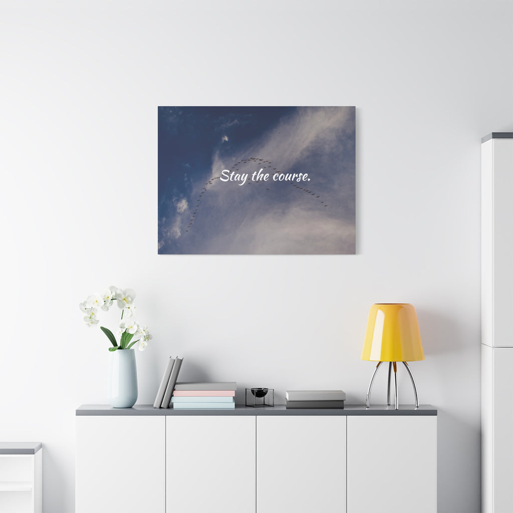 Wall art with motivational quote 'Stay the course.' in a modern interior setting.