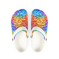 Colorful patterned sandals with white soles on a white background