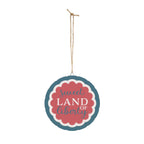Decorative sign with 'sweet land of liberty' text on a white background
