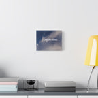 Decorative wall art with 'Stay the course.' text on a modern desk setup.