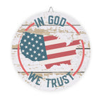 Decorative sign with American flag and 'In God We Trust' text on a wooden background
