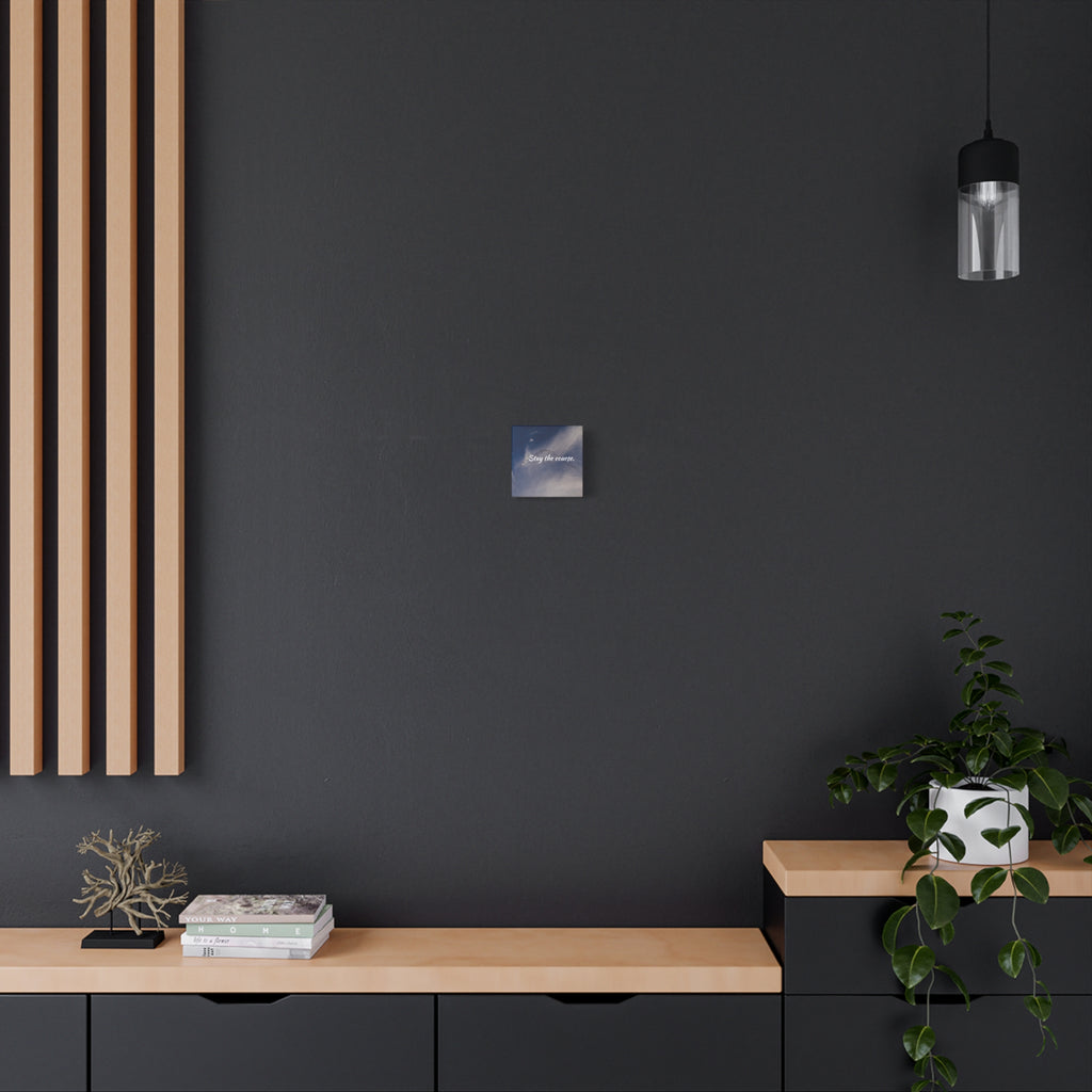 Modern interior with a dark wall, wooden shelf, and decorative items.