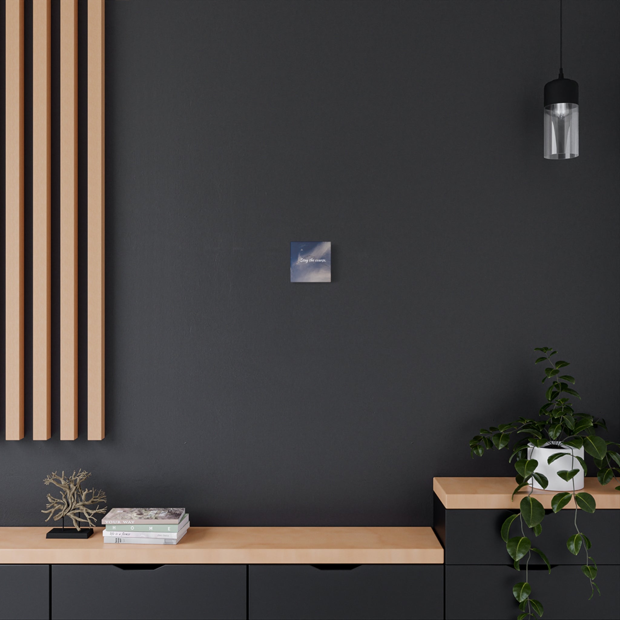 Modern interior with a dark wall, wooden shelf, and decorative items.