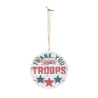 Round wooden sign with 'Thank You Troops' text and stars on a white background