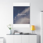 Poster with 'Stay the course.' text on a wall above a desk with decor items.