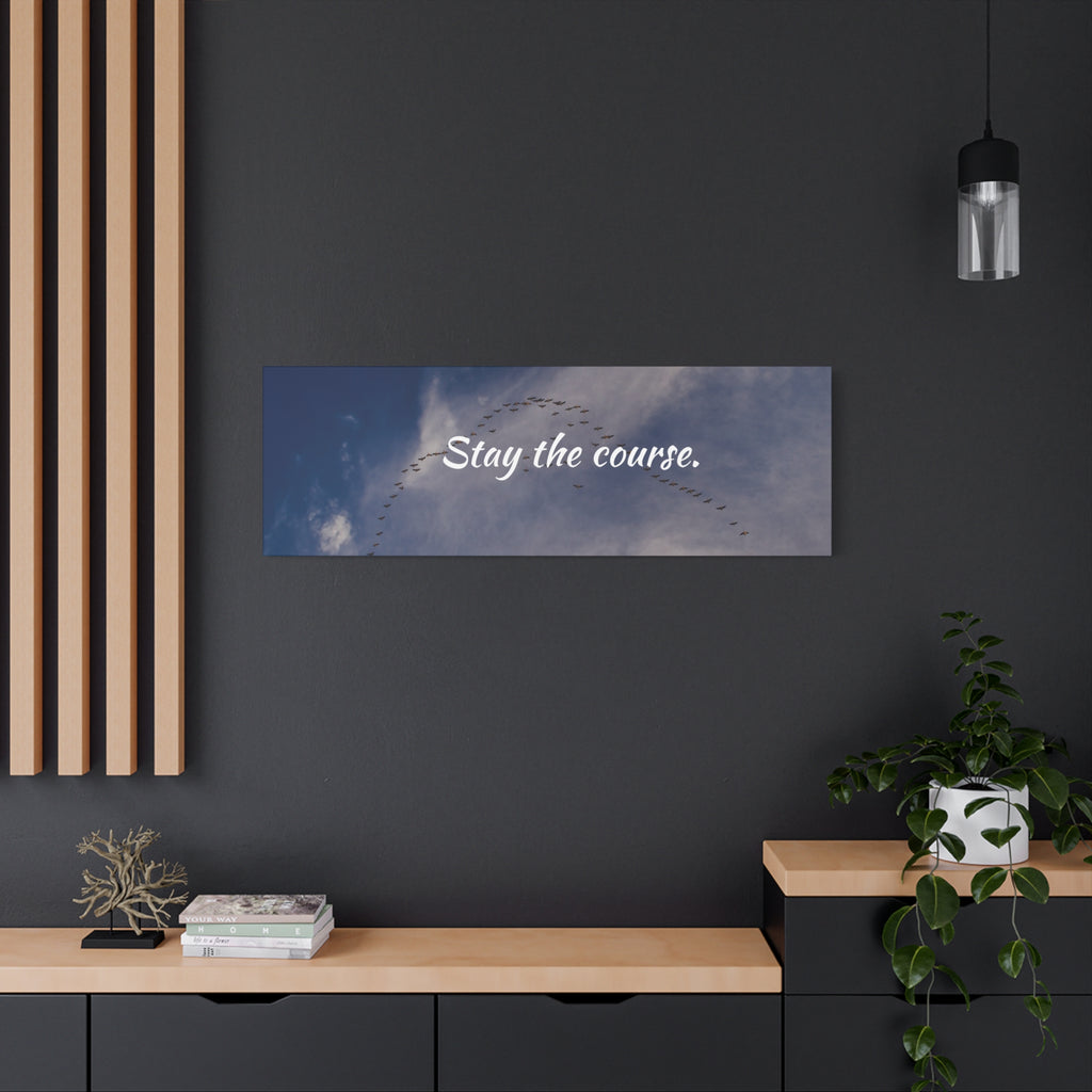 Wall art with 'Stay the course.' text in a modern interior setting.