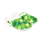 Green clogs with shamrock pattern on a white background