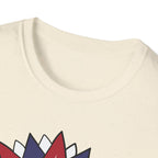Close-up of a beige t-shirt with colorful geometric designs on a white background