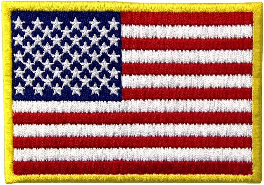 Embroidered patch of the American flag with a yellow border.