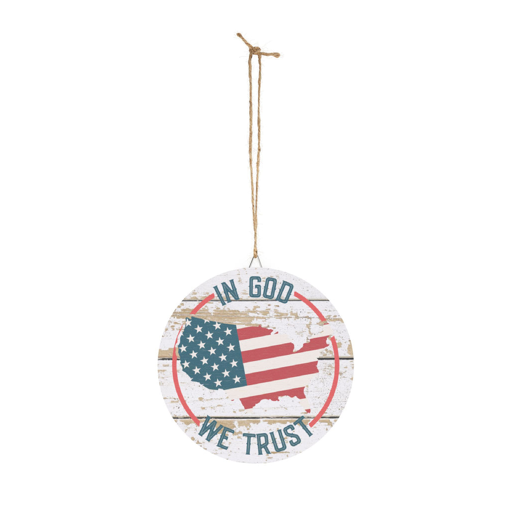 Round wooden sign with American flag and 'In God We Trust' text on a white background