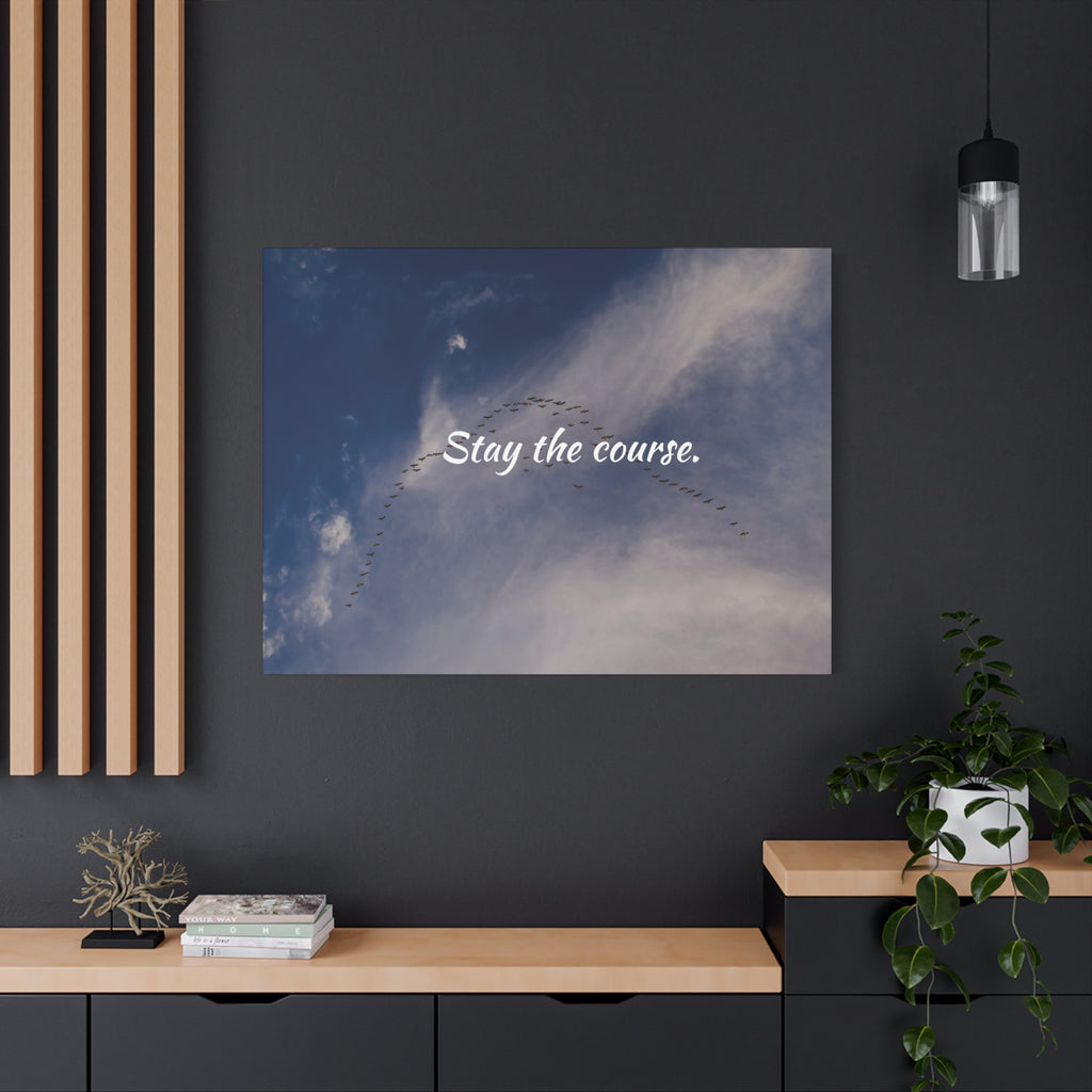 Poster with 'Stay the course.' text on a wall in a modern interior setting.