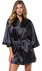 Woman wearing a black satin robe on a white background