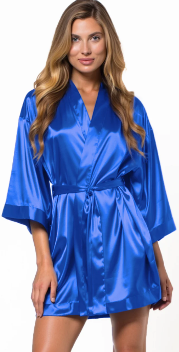 Woman wearing a blue satin robe on a white background