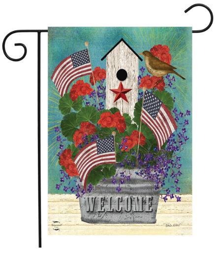 Decorative garden flag with American flags, flowers, and a birdhouse on a blue background.