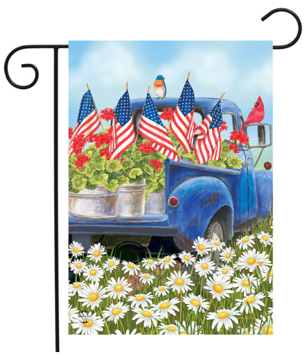Decorative garden flag with a blue truck, American flags, flowers, and birds on a white background.