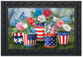 Decorative mat with American flag-themed flower pots and flowers on a grassy background.