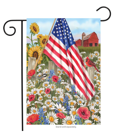 Decorative flag with American flag, flowers, and a barn in the background
