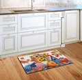 Decorative doormat with autumn design on a wooden floor in a kitchen.