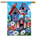 Decorative flag with birdhouses, birds, and American flags on a blue sky background.