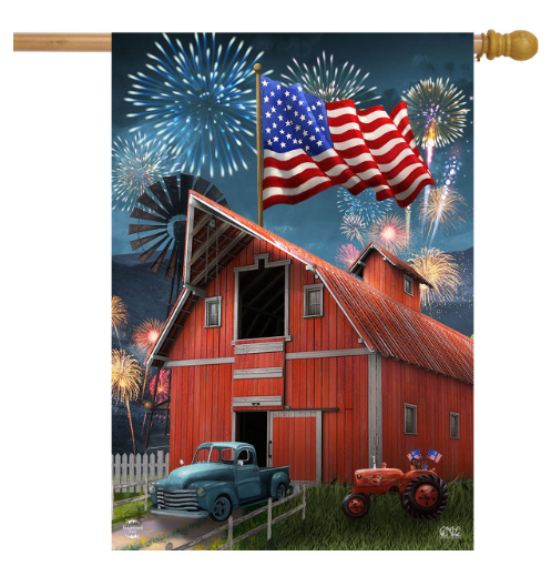 Decorative flag with a red barn, American flag, and fireworks against a blue sky.