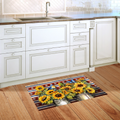 Decorative sunflower rug on a wooden floor in a kitchen setting