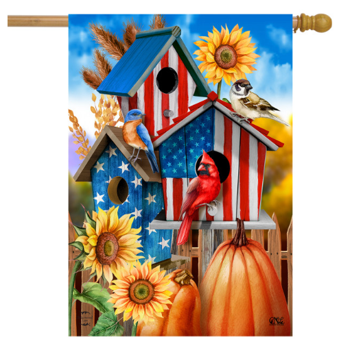 Decorative flag with birdhouses, birds, sunflowers, and pumpkins in a patriotic design.