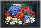 Cardinal bird perched on a branch with blue, red, and white flowers in a decorative frame.