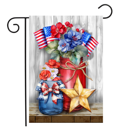Decorative flag with red and blue mason jars, flowers, and American flags on a wooden background.