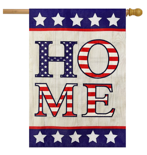 Decorative flag with 'HOME' text in American flag colors on a wooden pole.