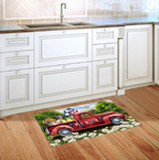 Decorative rug with a red truck design on a wooden floor in a kitchen.