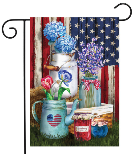 Decorative garden flag with flowers, mason jars, and a teapot against an American flag background.