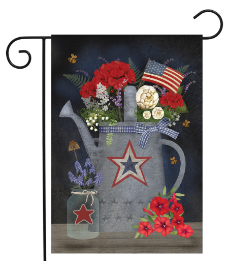 Decorative garden flag with a star-patterned watering can, flowers, and an American flag on a dark background.