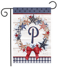 Decorative garden flag with stars, a bow, and a letter 'P' on a wooden background.