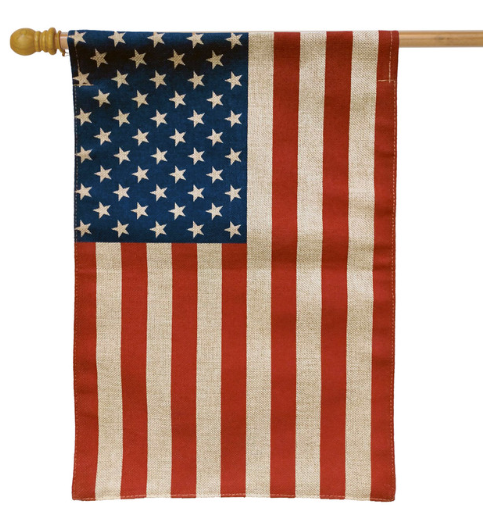 American flag with burlap texture on a wooden pole