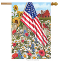 Decorative flag with American flag, sunflowers, and a barn in a field of flowers.