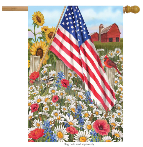 Decorative flag with American flag, sunflowers, and a barn in a field of flowers.