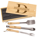Set of three BBQ utensils with wooden handles and metal ends, displayed in a wooden box with 'Donaldson' branding.