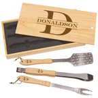Set of three BBQ utensils with wooden handles and metal ends, displayed in a wooden box with 'Donaldson' branding.